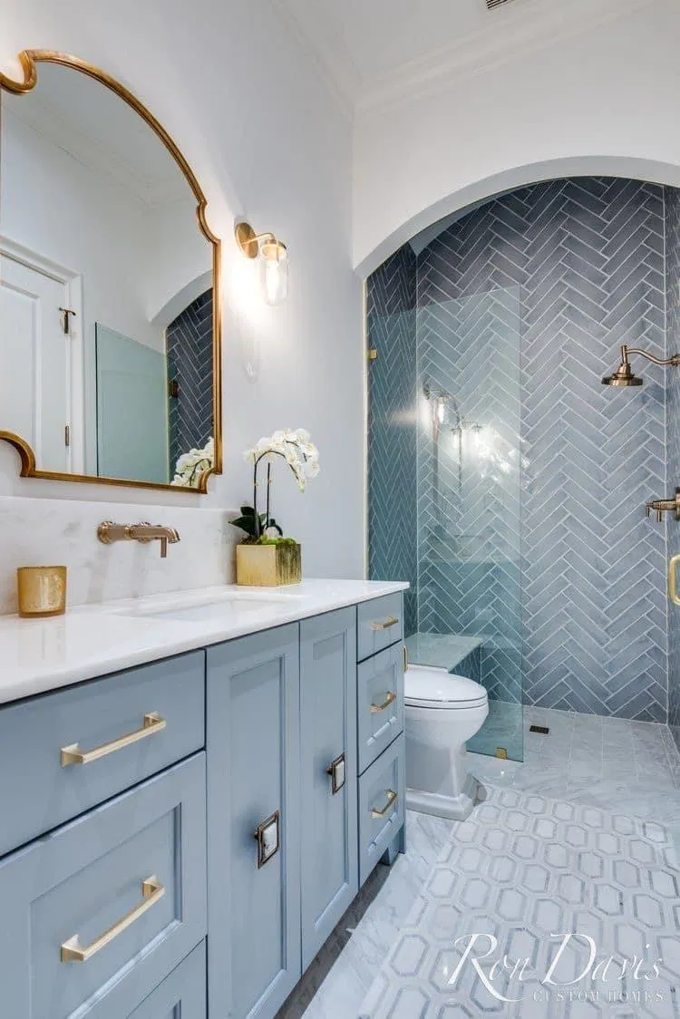 Coastal Elegance: Soft Blues for a Modern Bathroom Aesthetic - Coastal design in 2025 is all about subtlety. Think breezy colors, gold accents, and patterns like chevron that give a nod to the ocean without feeling cliché. It’s relaxed, refined, and effortlessly chic.