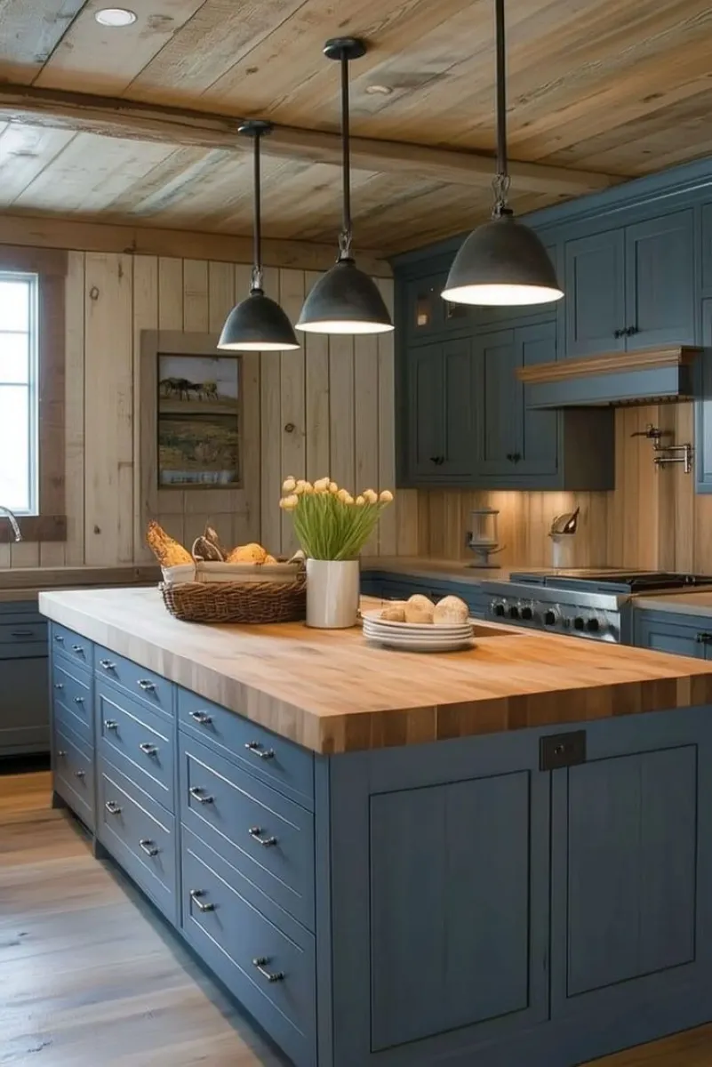 Farmhouse Blue with Butcher Block Top A deep blue kitchen island topped with a butcher block surface adds character and functionality. The butcher block is not only durable but also budget-friendly. You can achieve a similar look by sanding and staining an existing wood countertop or opting for an affordable DIY butcher block alternative.