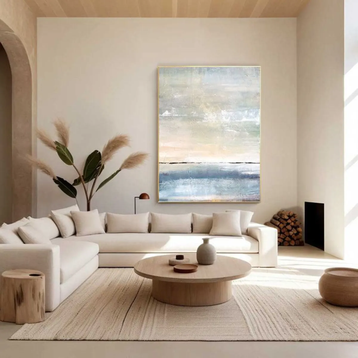 Minimalism embraces openness. In the featured image, a large abstract painting complements the neutral furnishings, creating a gallery-like ambiance. Natural elements like dried pampas grass or woven baskets soften the sharp edges of minimalism.