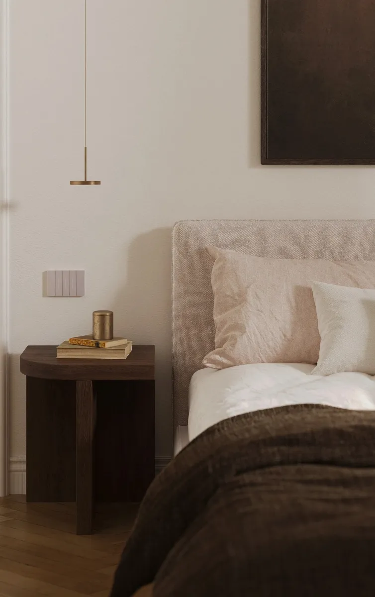 Elegant nightstand styling in a minimalist bedroom. Wooden textures, brass pendant lighting, and soft textiles create a cozy atmosphere. #BedroomInspo #ModernDesign