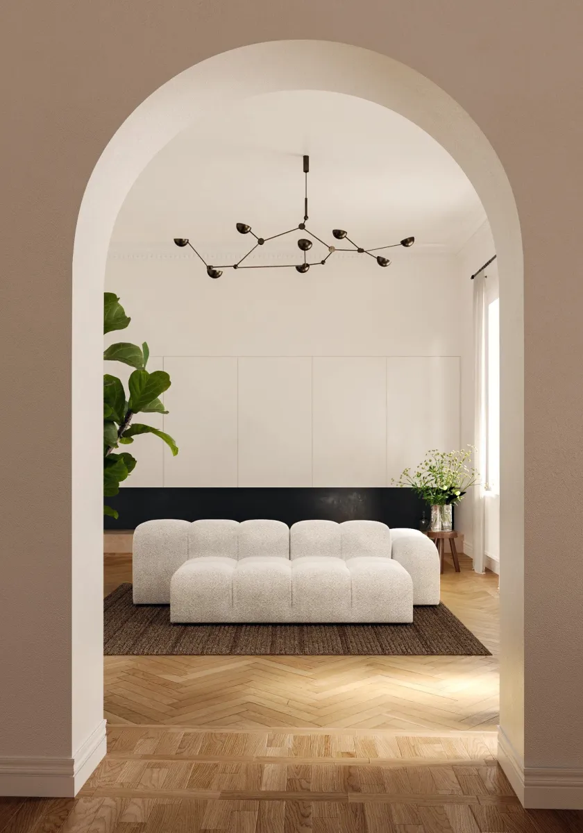 Seamless transition between living and dining room through a stunning arched entryway. Warm neutrals and soft natural light create an inviting space. #ModernHome #NeutralDecor