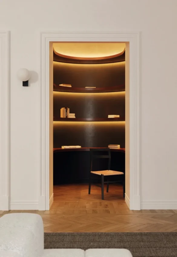 A cozy reading nook with illuminated shelving and modern home decor elements. Perfect inspiration for a sophisticated study corner. #ReadingNook #CozyInteriors