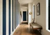 This Stripe Trend Is Taking Over 2026, Here’s How to Use It Learn how bold stripes are dominating home decor in 2026. This hallway accent wall idea pairs navy and cream with minimalist styling. Save this for your next project. #StripedDecor #2026Trends #AccentWall #HomeStyling