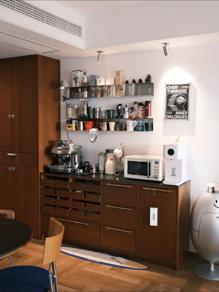 A built-in coffee bar instantly adds personality to a small apartment. Open shelves, mugs, espresso gear, and warm lighting turn a simple cabinet into a stylish coffee station. Save this if you want a cozy home coffee corner. #coffeestation #homecoffeebar #apartmentkitchen #coffeecorner #kitchenstyling #openShelving #cozyhome #apartmentideas #kitchendecor #coffeeaesthetic