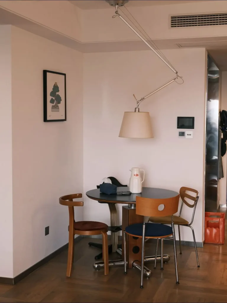 This tiny dining corner proves you don’t need a full dining room to create a cozy place to eat. Mixing different chairs around a round table adds personality and relaxed style. Save this idea if you love collected interiors. #mismatchedchairs #diningnook #apartmentdining #smallapartmentideas #curatedhome #diningroomdecor #interiorstyling #homedecorideas #cozyapartment #designinspiration