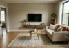 Small Living Room TV Wall Ideas That Actually Work (When Space Is Non-Negotiable) Small living room TV wall with slim floating console and mounted TV on warm greige wall, showing how to style a TV wall in a compact space.