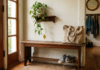 Entryway Bench With Storage: The 4 Types (And Which One Actually Fits Your Space) Wide entryway shot with narrow bench, shoes underneath, coat hook above, tote on one end.